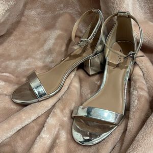 Call it spring silver heels. Size 7 but run a bit big.